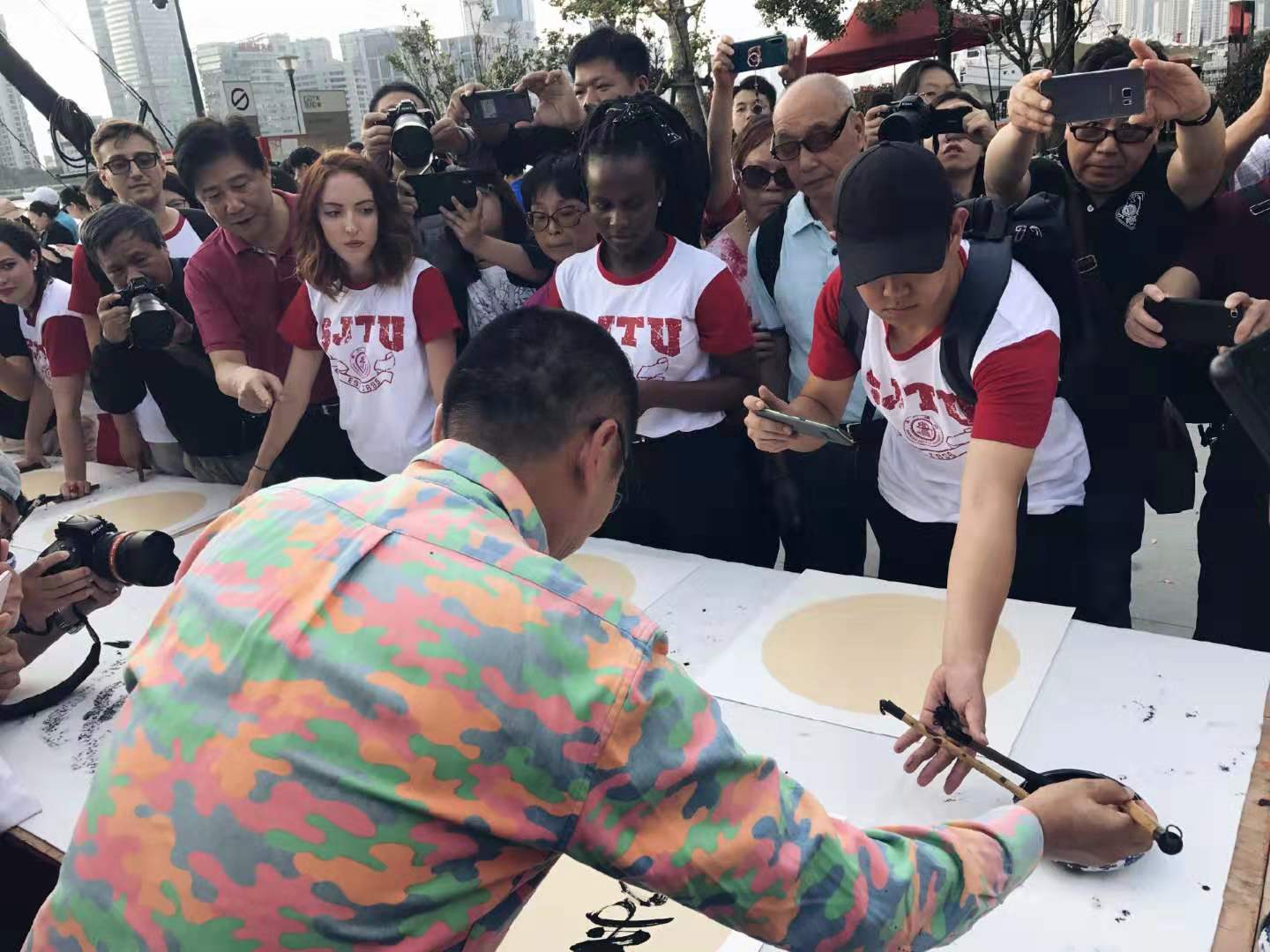 6) Students select their brushes as they prep for the calligraphy event in Shanghai, China..jpeg